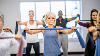 Fitness class with resistance bands - Halo Health